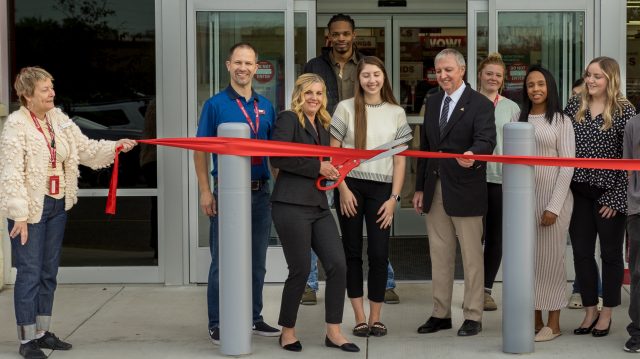 Principal cuts ribbon at grand opening