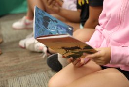 students reading book