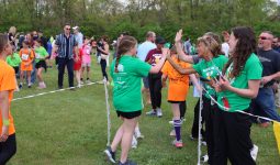 Running is Elementary: staff congratulate runners as they finish