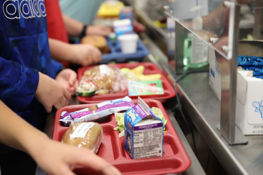 Closeup shots of students school lunch trays