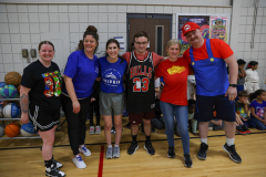 Group of teachers posing for a picture in gymnasium.